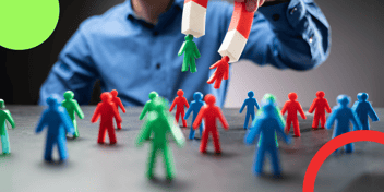 Representación visual de una agencia de marketing y ventas B2B utilizando un imán para atraer clientes potenciales. La imagen muestra figuras de colores (verde, rojo y azul) que representan prospectos cualificados, resaltando estrategias de atracción y segmentación efectivas.